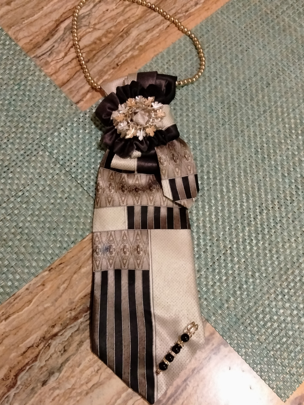 Elegant Black and Cream Decorative Tie Necklace with Brooch